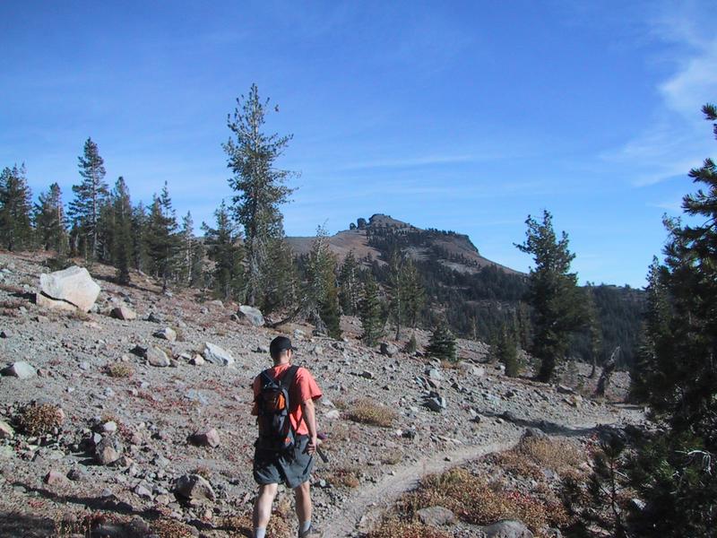 [Leo on trail in rock field]