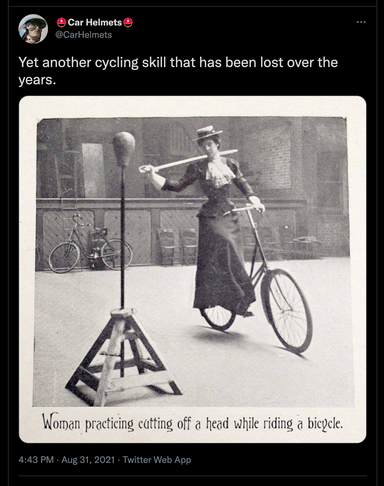 Yet another cycling skill that has been lost over the years. Image titled 'Woman practicing cutting off a head while riding a bicycle'