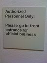 [Please go to front entrance for official business]