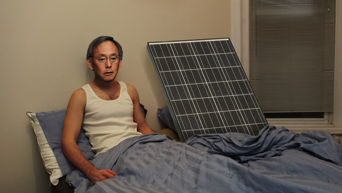 [From The Onion article: Steven Chu in bed next to a solar panel]
